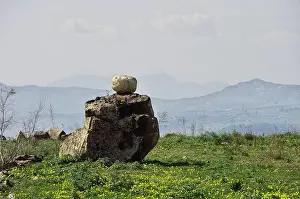 Sicilia Prints: natural rock formation of Sicily nature with small white stone ball