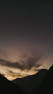 Nature's masterpiece: Sun-kissed clouds dance across a sky ablaze with colour