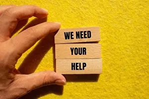 Appeal Prints: We need your help message written on wooden blocks with yellow background