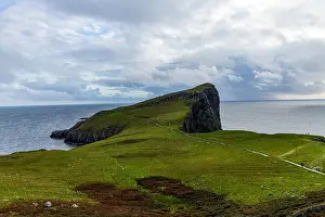 Epic Prints: Neist Point at sunset is a breathtaking sight—its lighthouse stands against dramatic cliffs