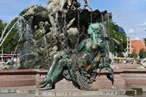Neptune Prints: The Neptune water fountain with a woman bronze statue built in 1891 and was designed by Reinhold Begas