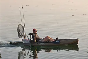 Mode Of Transport Prints: The Netherlands, Zierikzee, Fisherman in cycle-kayak with electric motor