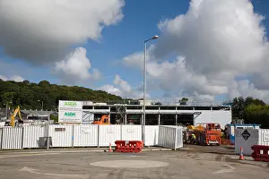 Building Site Prints: New Asda supermarket building construction site with fence round on edge of town Llangefni Anglesey North Wales UK