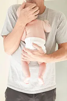 Diaper Prints: New dad holding baby in a diaper