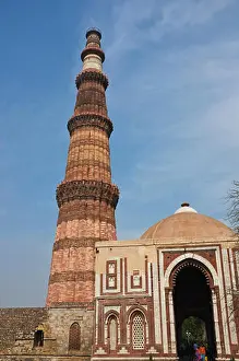 Mughal Prints: New Delhi, India. The ancient Qutub-Minar site in Delhi is a popular visitor attraction