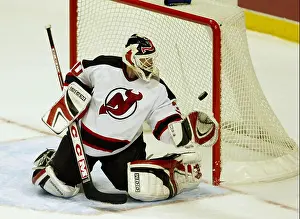 Hockey Prints: New Jersey Devils goalie Martin Brodeur makes a save against the Anaheim Mighty Ducks in the first period of play