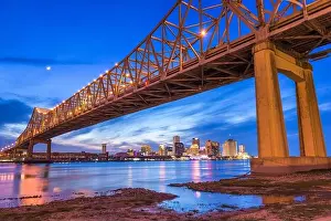 New Orleans, Louisiana, USA at Crescent City Connection Bridge over the Mississippi River at dusk