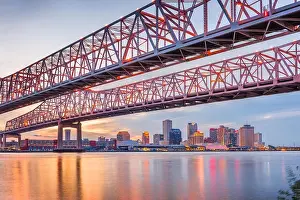 New Orleans, Louisiana, USA at Crescent City Connection Bridge over the Mississippi River at dusk
