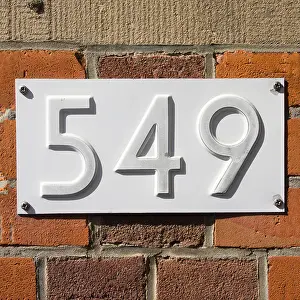 Directional Prints: New white house number five hundred and forty-nine, embossed in a metal plate