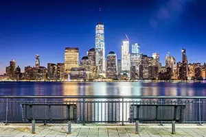 New York City financial district on the Hudson River at twilight