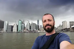 New York City selfie photo by a young adult male. Bearded man portrait