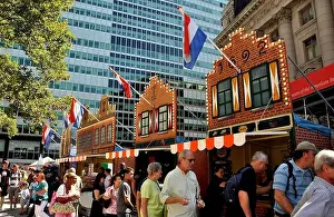New York City: Visitors in front of gabled facades of 17th century Dutch buildings at the New Amsterdam Village