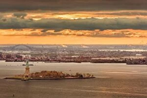 Images Dated 15th November 2016: New York Harbor, New York, USA with the statue of liberty and Bayonne, New Jersey in the background