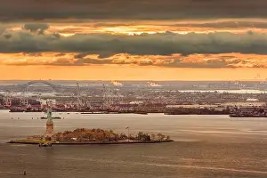 New York Harbor, New York, USA with the statue of liberty and Bayonne, New Jersey in the background