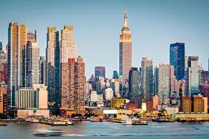 New York, New York, USA downtown city skyline on the Hudson River at dusk