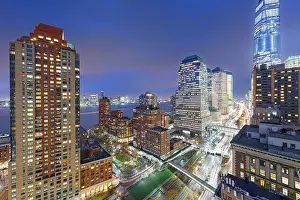New York, New York, USA financial district cityscape over the West Side Highway at dusk