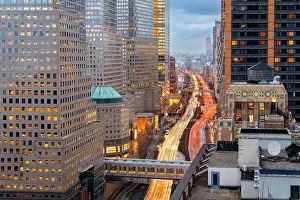 New York, New York, USA financial district cityscape over the West Side Highway at dusk