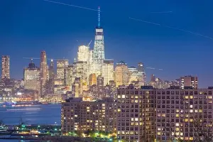 New York, New York, USA at the Lower Manhattan skyline at night from New Jersey