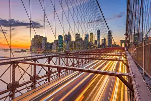 New York, New York, USA Lower Manhattan skyline after sunset from the Brooklyn Bridge