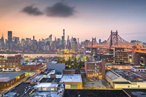 New York, New York, USA Manhattan skyline with the Queensboro Bridge