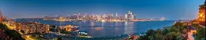 New York, New York, USA Midtown Manhattan skyline on the Hudson River at night