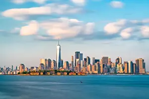 New York, New York, USA skyline from the harbor with Ellis Island