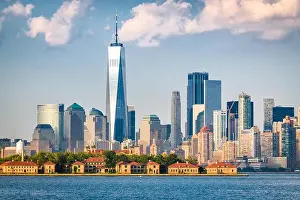 New York, New York, USA skyline from the harbor with Ellis Island