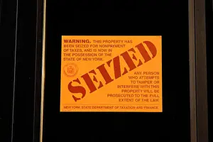 Seizure Prints: A New York State Department of Taxation and Finance Seized sticker for the nonpayment of taxes (tax lien)