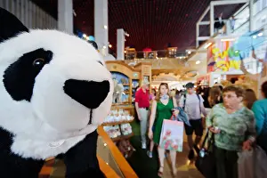 Panda Prints: New York. Visitors pass by a giant doll of a Panda bear in the famous FAO Schwarz toy store