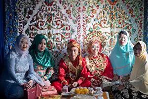 Veil Prints: A newly married couple and their family at a wedding celebration, Sulawesi, Indonesia