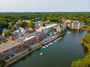 River Drone Prints: Newmarket Mills building aerial view on Lamprey River on Main Street in historic town center of Newmarket