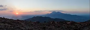 Nicaragua, Leon province, tourists looking at the sunset and San Cristobal volcano from Telica volcano