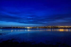 Images Dated 4th April 2016: Night view at blue hour of Galati City, Romania with reflections in Danube River and stars on sky