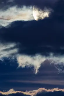 Nightmare Prints: Nighttime clouds glowing from light of full Supermoon over Rocky Mountains