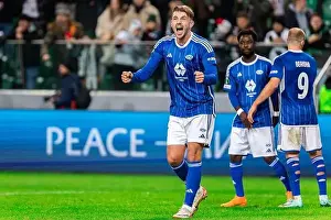 Football Player Prints: Niklas Odegard of Molde FK celebrates victory during the UEFA Europa Conference League knockout round play-off match