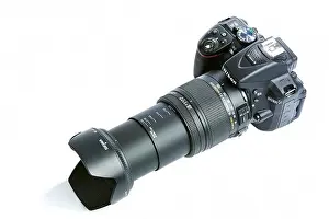 Dslr Prints: Nikon D5300 DSLR Camera with Zoom Sigma 18-250 mm OS HSM Macro Lens isolated on white background