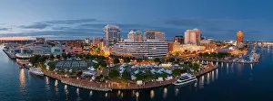 Norfolk, Virginia, USA downtown city skyline from over the Elizabeth River at dusk