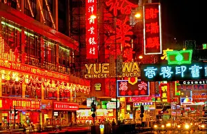 Double Decker Bus Prints: Nostalgic night street view of vibrant neon shop signs over hanging traffic along Nathan Road