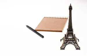 Reminder Prints: Notebook and pen with Eiffel Tower on the background