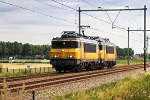 Delay Prints: NS Alsthom 1700 locmotives 1750 and 1752 at Railroad track at Moordrecht in the Netherlands