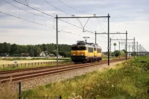 Delay Prints: NS Alsthom 1700 locmotives 1750 and 1752 at Railroad track at Moordrecht in the Netherlands