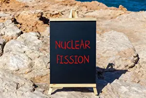 Nucleus Prints: Nuclear fission symbol. Concept words Nuclear fission on beautiful black chalk blackboard