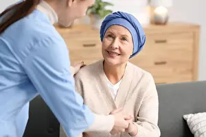 Supporting Prints: Nurse helping woman with cancer at home
