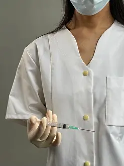 Prevention Prints: Nurse holding syringe with covid-19 vaccine.