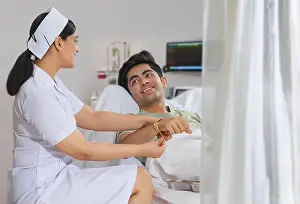 Exhilaration Prints: NURSE IN THE ROLE OF A SISTER TYING RAKHI TO THE BOY ADMITTED IN THE HOSPITAL