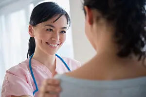 Concern Prints: Nurse talking to patient in hospital