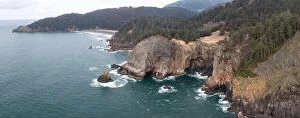 Aerial Landscape Collection: The nutrient-rich Pacific Ocean washes against the dramatic, rocky shoreline of Oregon
