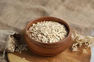 Burlap Prints: Oat flakes, panicles and burlap on table, closeup
