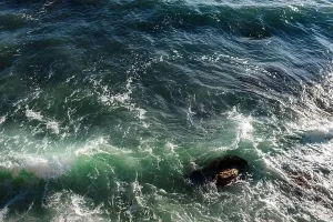 Ocean Wave Prints: Ocean wave background breaking sea water rocky shore rough seas turquoise water gradient foam