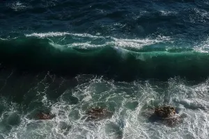 Hurricane Prints: Ocean wave background breaking sea water rocky shore rough seas turquoise water gradient foam
